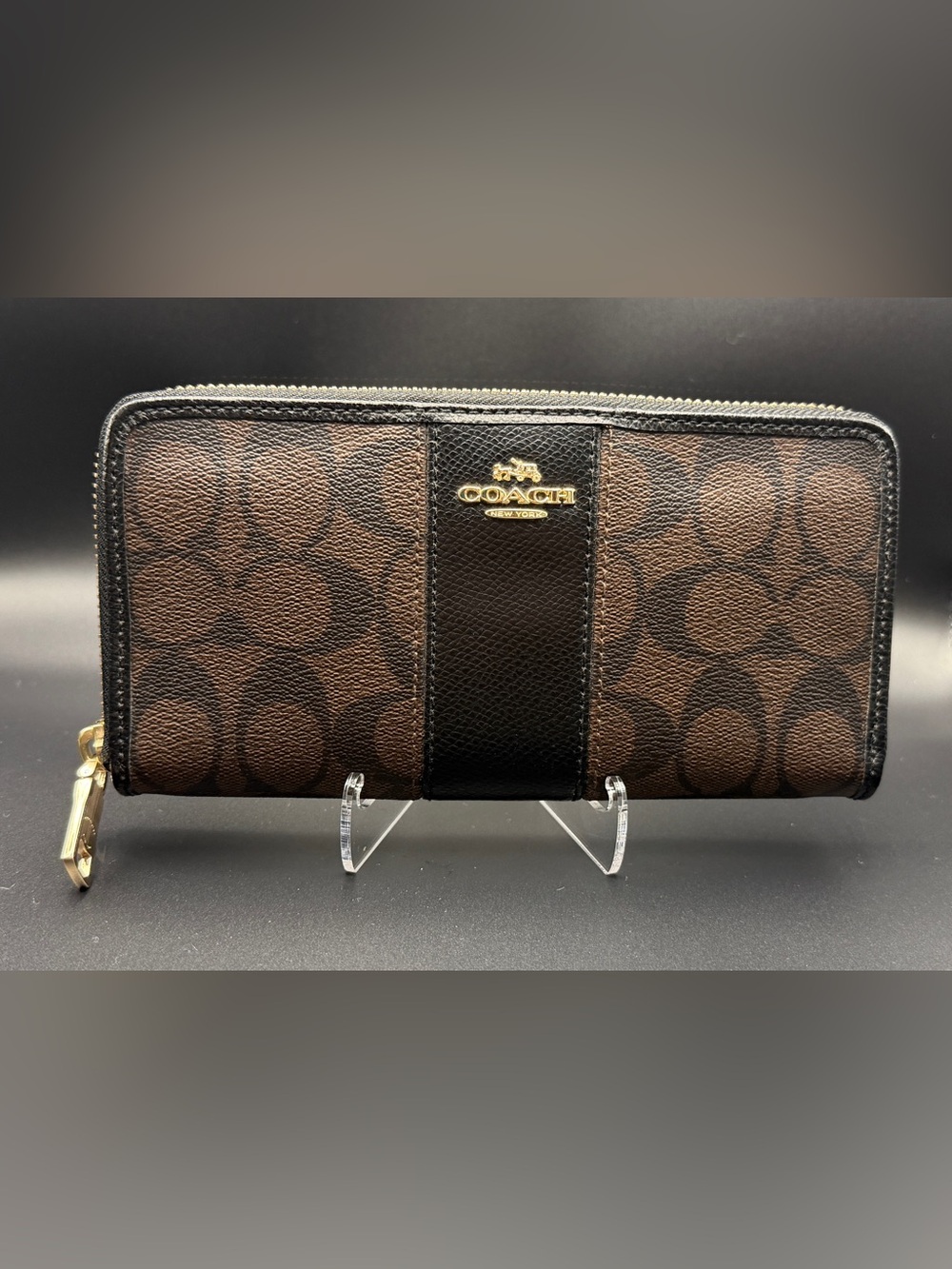 Coach's signature coated canvas and leather trim.
F52859